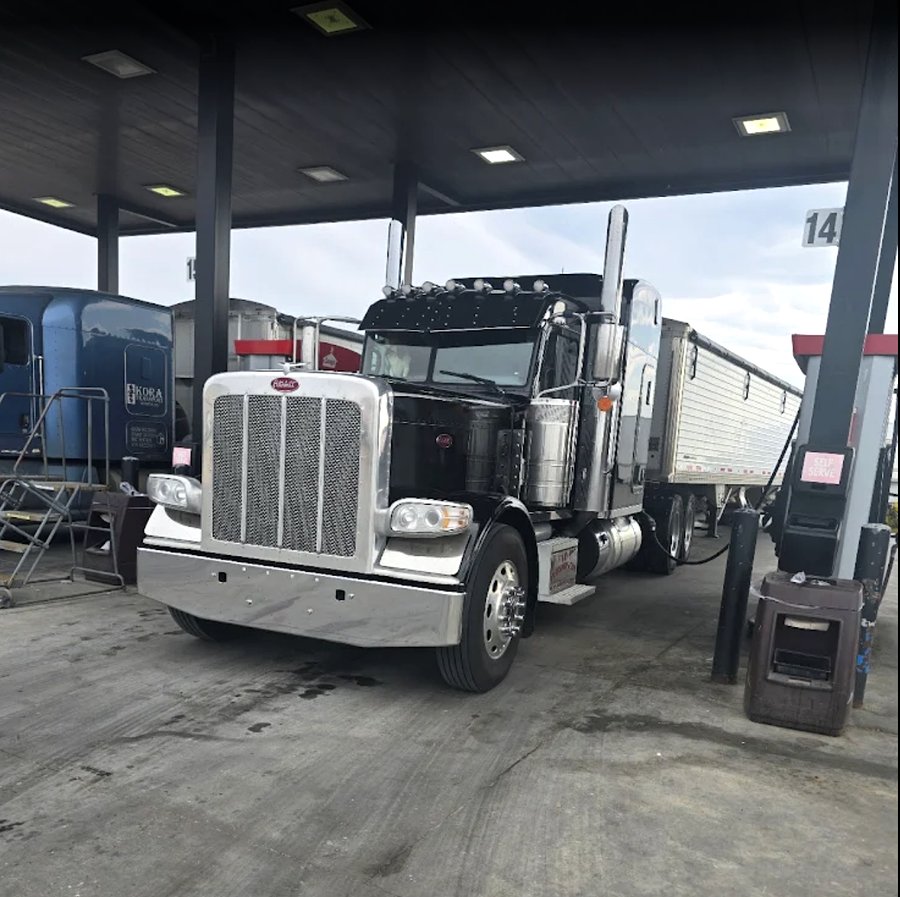 Tyson's Peterbilt 389 and hopper trailer at the fuel island