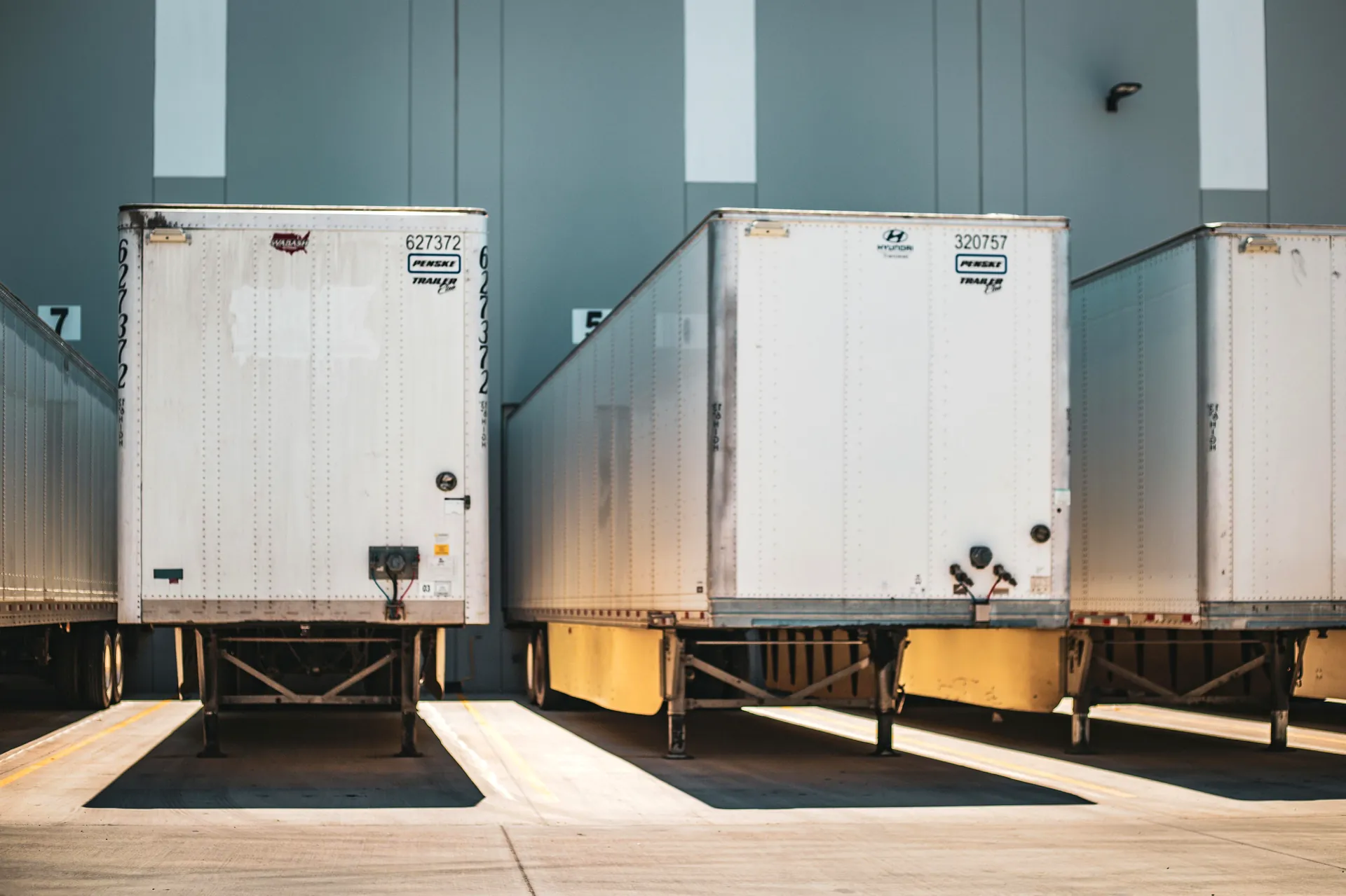 Reefer trailers at the loading dock — refrigerated freight financed by Trust Alliance Capital
